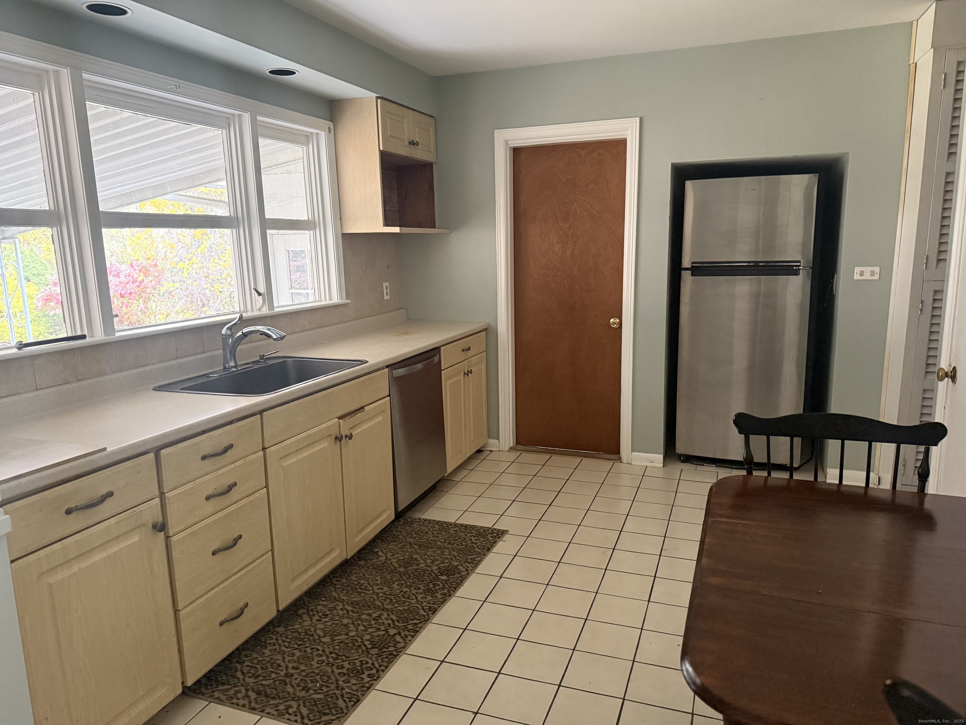 8 Nelson Place Fairfield, CT 06825 - Photo 8 of 32 a spacious bathroom with a granite countertop sink a mirror and a bathtub with shower