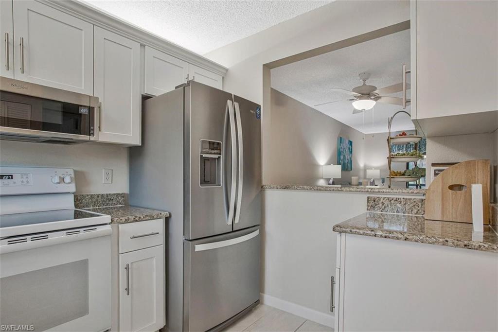4258 27th Court Southwest, Unit 106 Naples, FL 34116 - Photo 3 of 19 Concealed lighting The updated and upgraded cabinets, appliances and flooring give a fresh modern look.