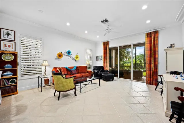 a kitchen with stainless steel appliances granite countertop a sink and a refrigerator