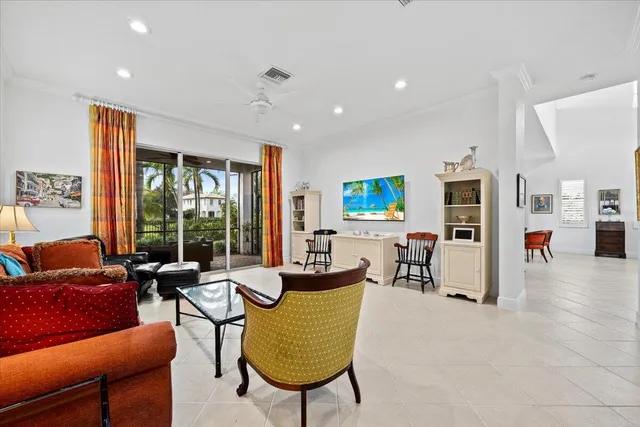 a kitchen with stainless steel appliances white cabinets white stove a microwave and a refrigerator