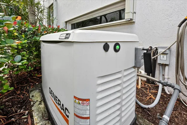 a view of a dining room with furniture one side kitchen view and a flat screen tv