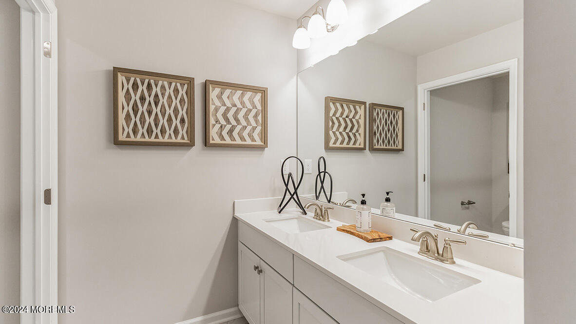 19 Victoria Gdns Square Neptune, NJ 07753 - Photo 20 of 20 a bathroom with a sink and a mirror
