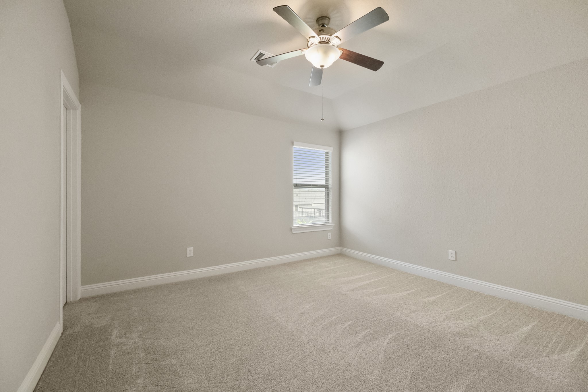 7502 Windsor Park Court Spring, TX 77379 - Photo 36 of 50 a view of an empty room with a window