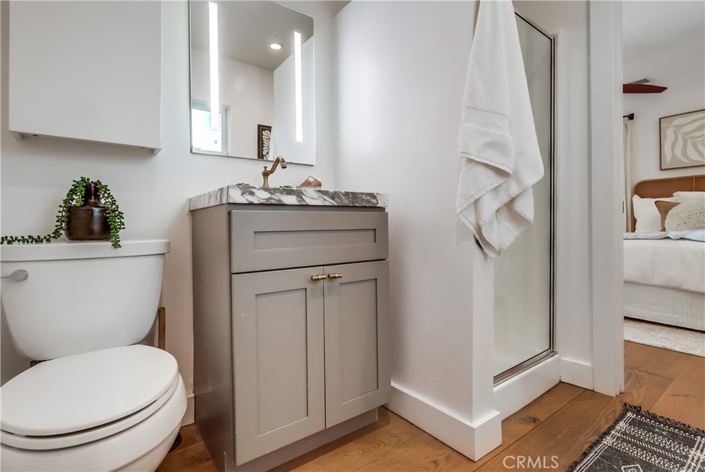 1007 Marview Avenue Los Angeles, CA 90012 - Photo 12 of 27 a bathroom with a toilet a sink and shower