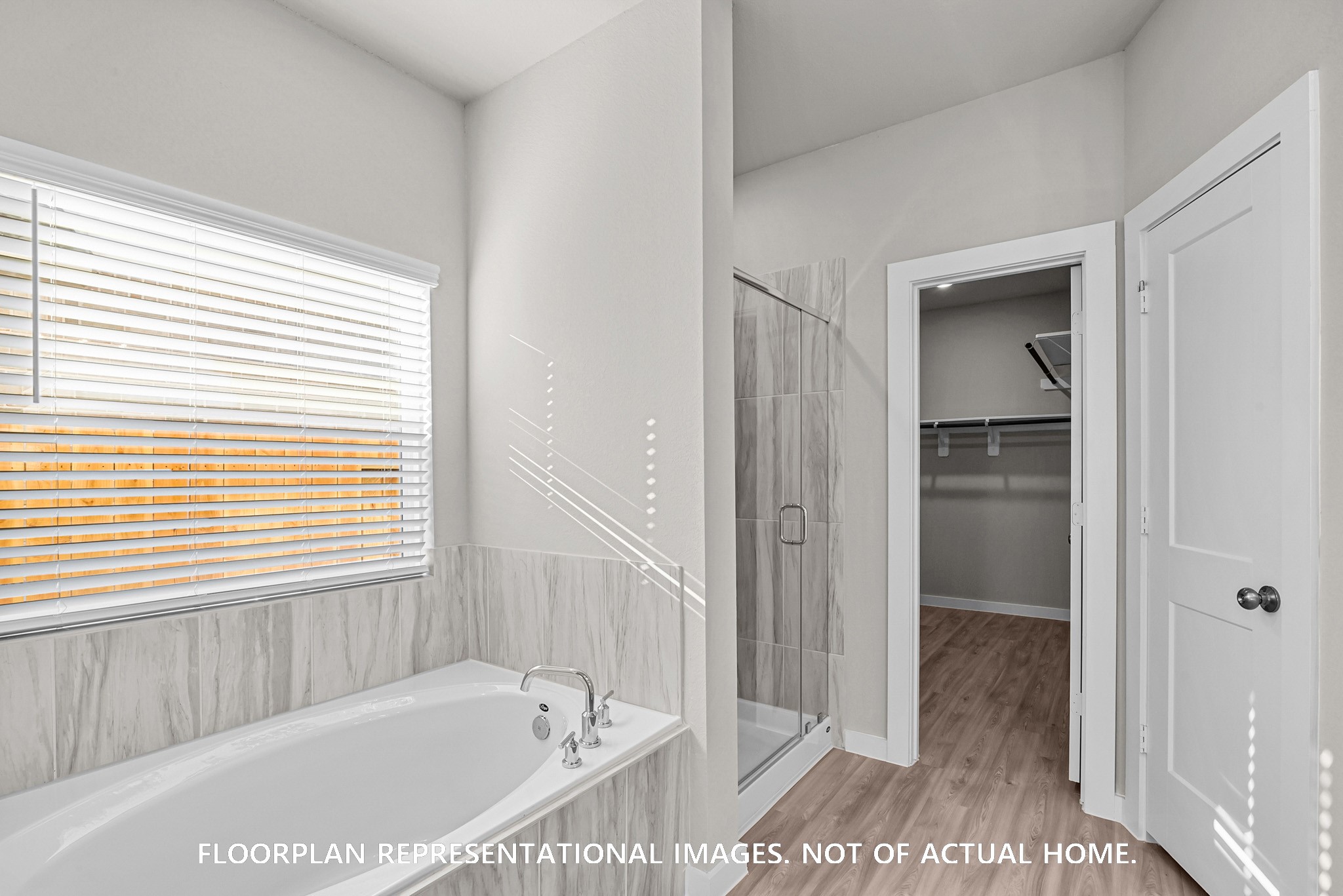 8311 Blue Shell Lane Cypress, TX 77433 - Photo 15 of 22 a bathroom with bathtub and a shower