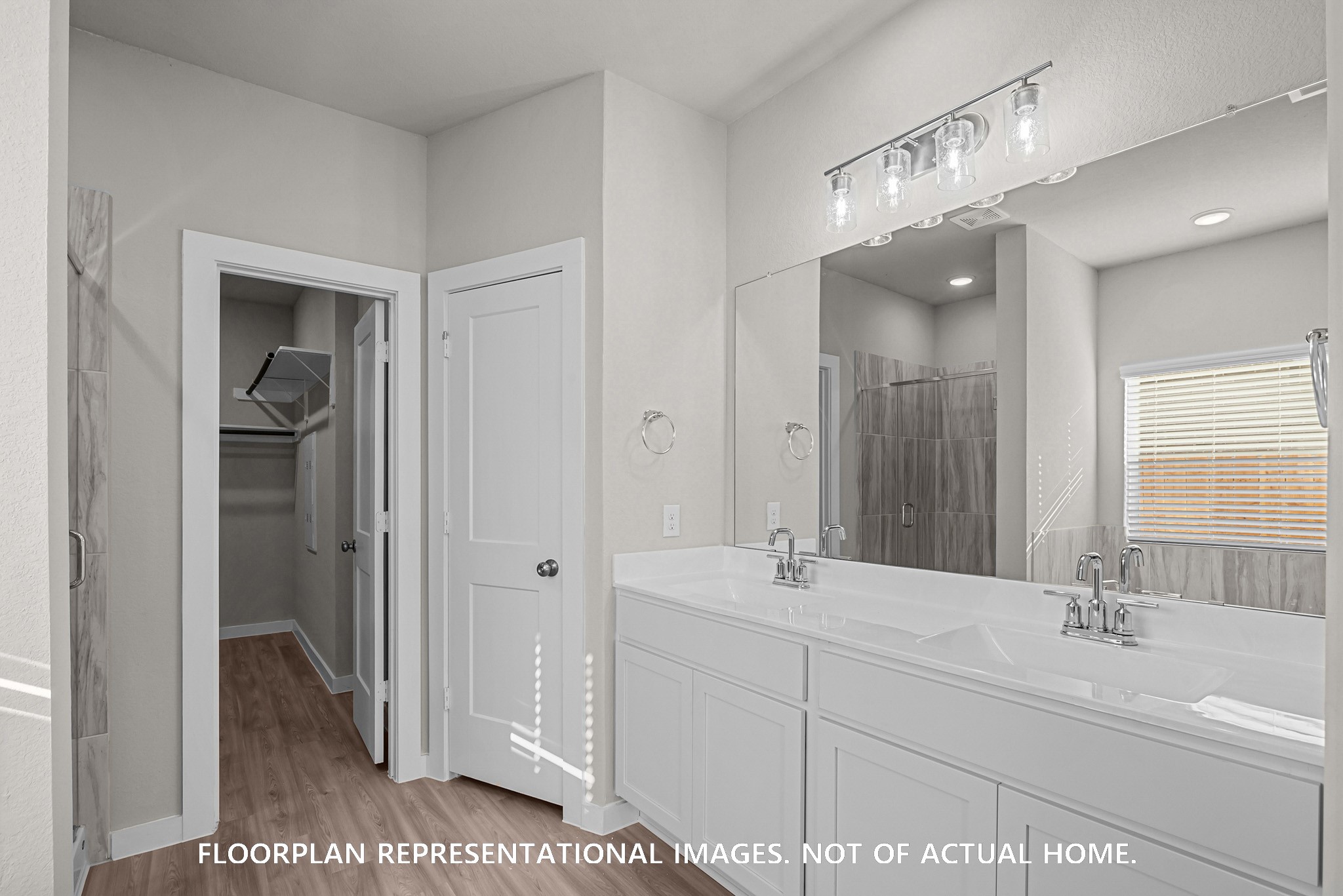 8311 Blue Shell Lane Cypress, TX 77433 - Photo 16 of 22 a bathroom with a double vanity sink and a mirror