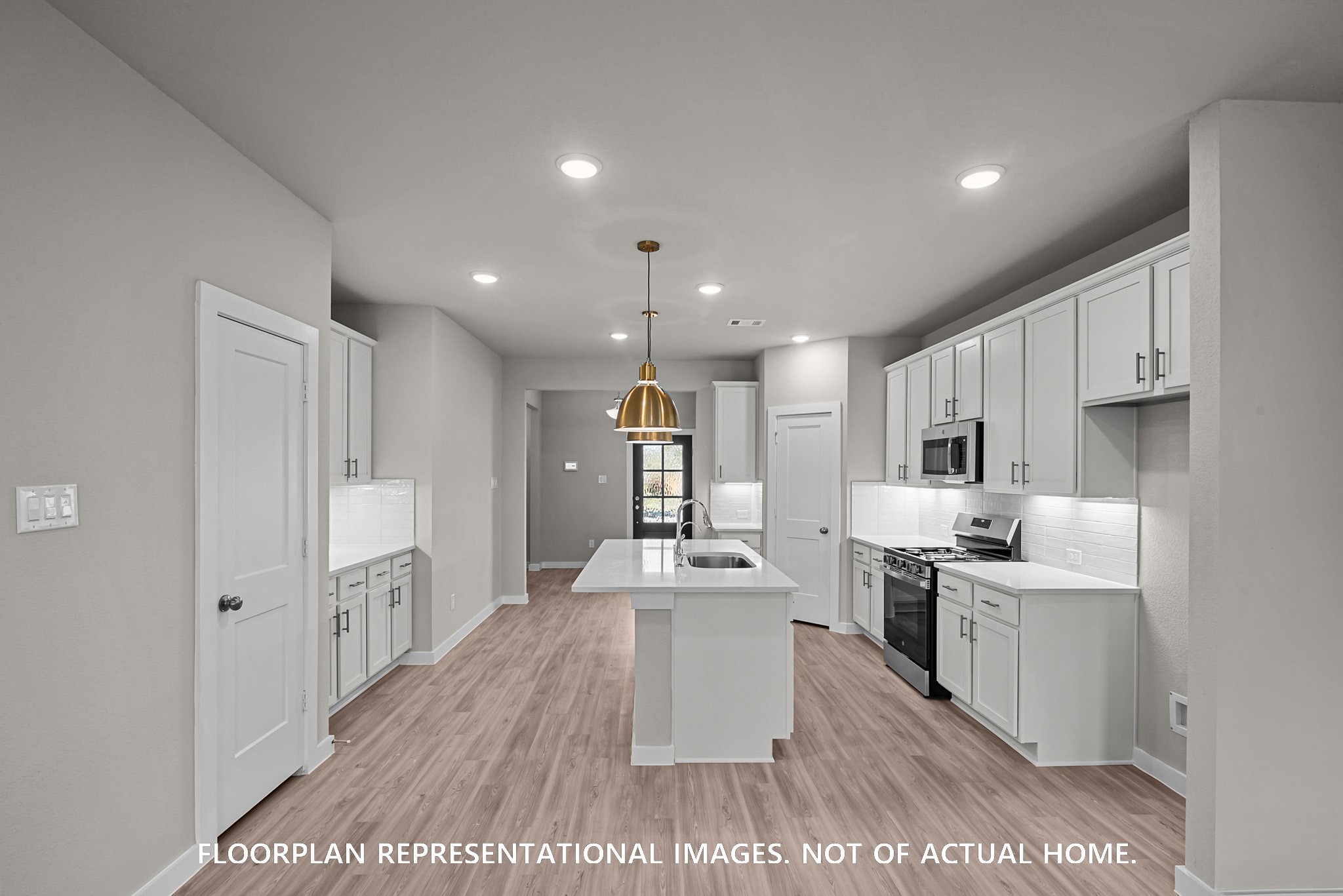 8311 Blue Shell Lane Cypress, TX 77433 - Photo 7 of 22 a kitchen with stainless steel appliances kitchen island granite countertop a refrigerator oven a sink dishwasher and white cabinets with wooden floor