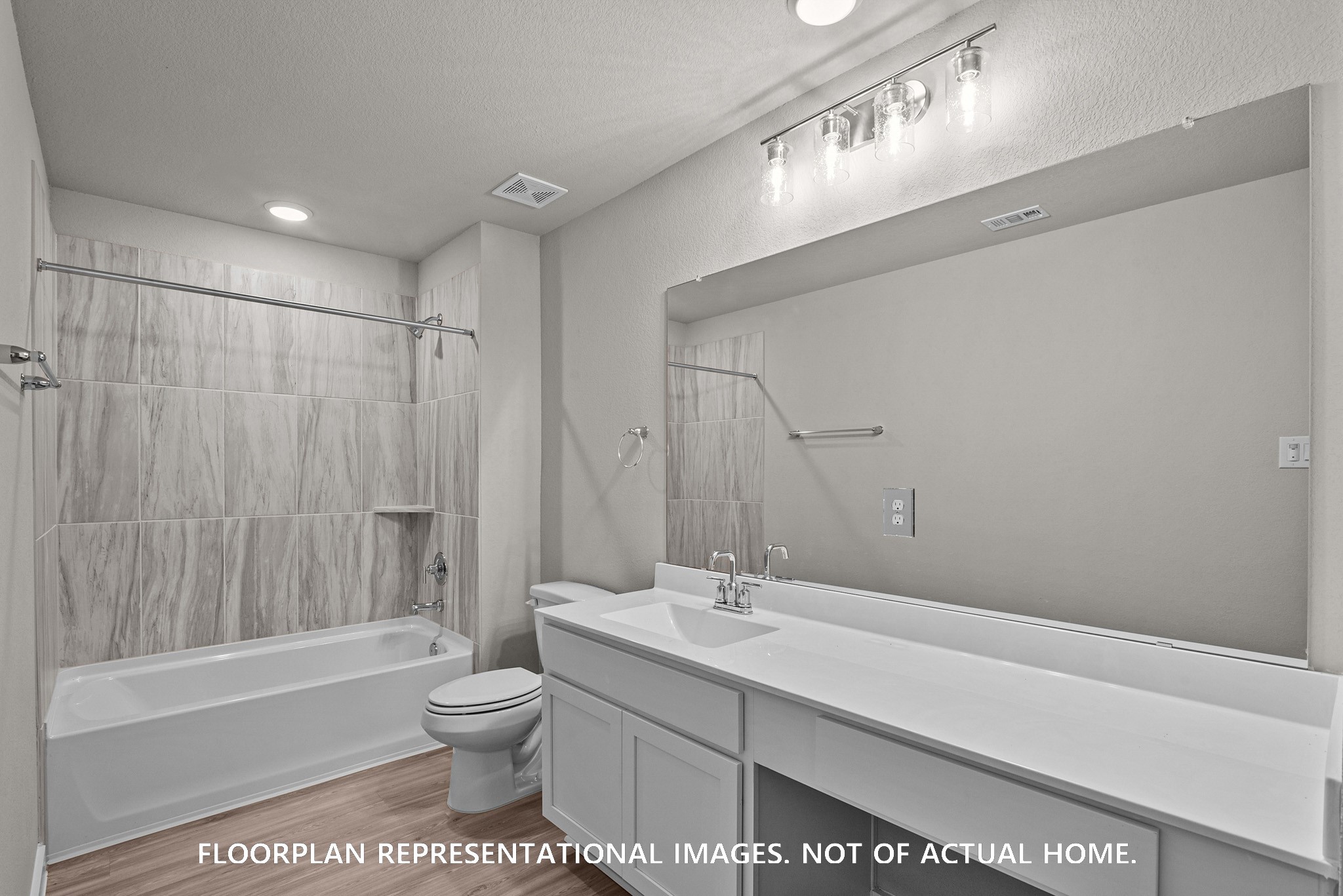 8311 Blue Shell Lane Cypress, TX 77433 - Photo 10 of 22 a bathroom with a bathtub shower sink vanity mirror and toilet