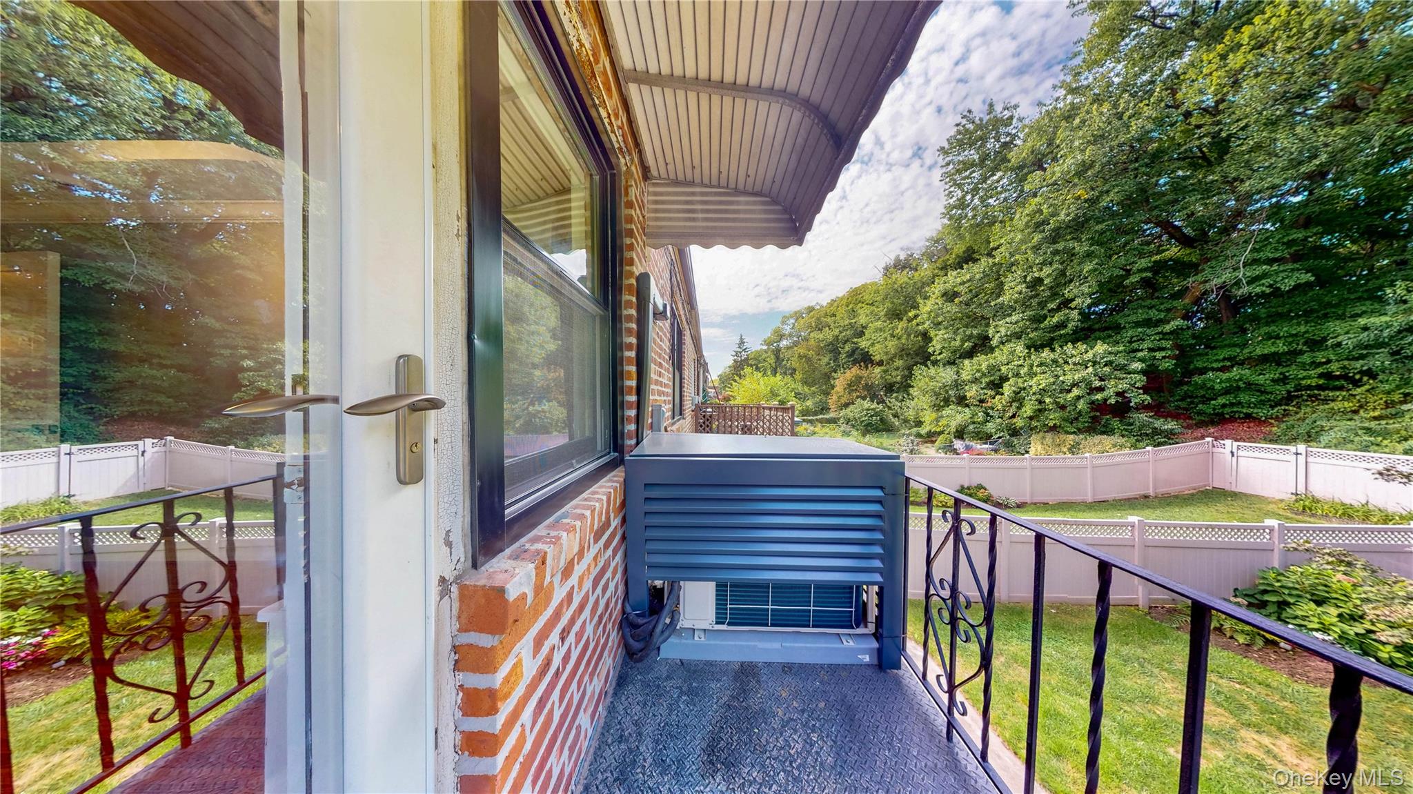 67-04 Selfridge Street, Unit 2 Queens, NY 11375 - Photo 20 of 21 a view of balcony with wooden floor and fence