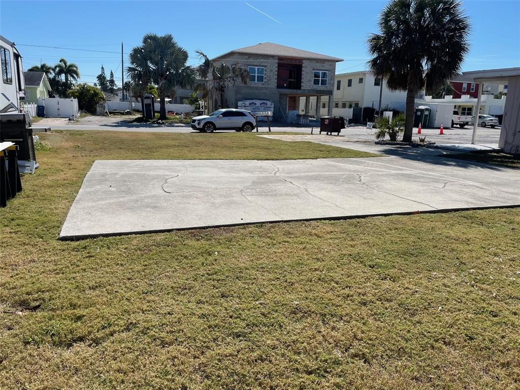144th Avenue Madeira Beach, FL 33708 - Photo 4 of 5 a view of swimming pool with outdoor seating and covered with trees