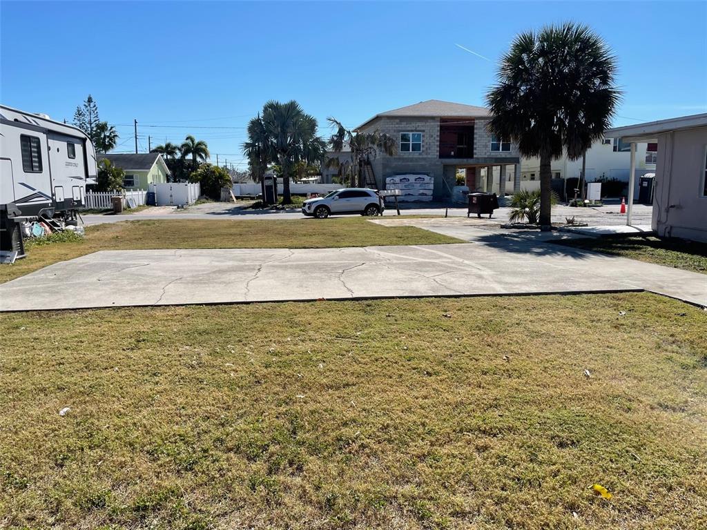 144th Avenue Madeira Beach, FL 33708 - Photo 5 of 5 a view of a swimming pool with a lounge chairs