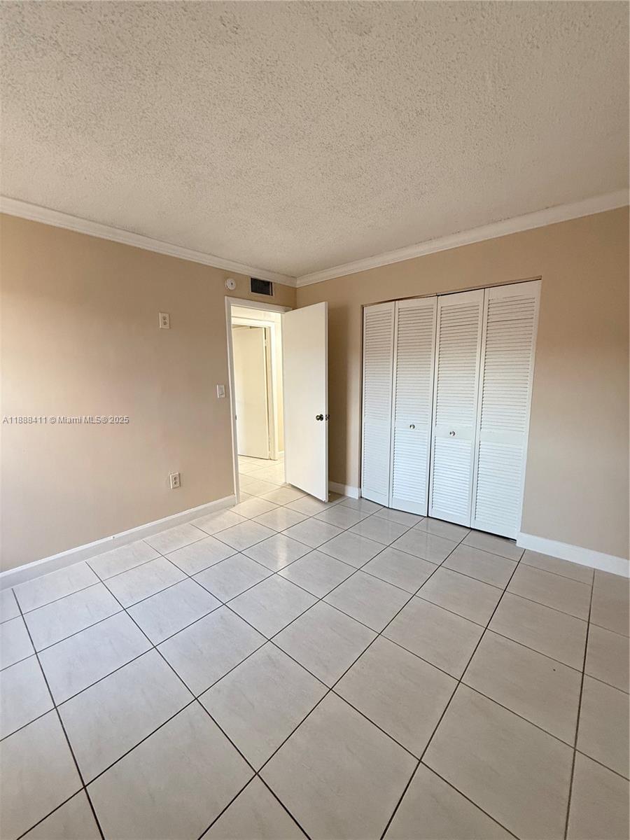 1725 West 60th Street, Unit 105 Hialeah, FL 33012 - Photo 14 of 19 a view of an empty room and a window