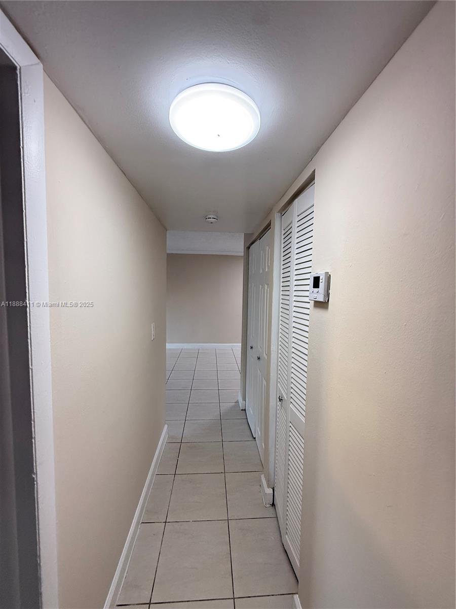 1725 West 60th Street, Unit 105 Hialeah, FL 33012 - Photo 15 of 19 a view of a hallway