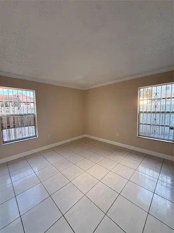 a view of an empty room and window