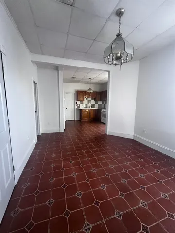 a kitchen with a stove a sink and a refrigerator