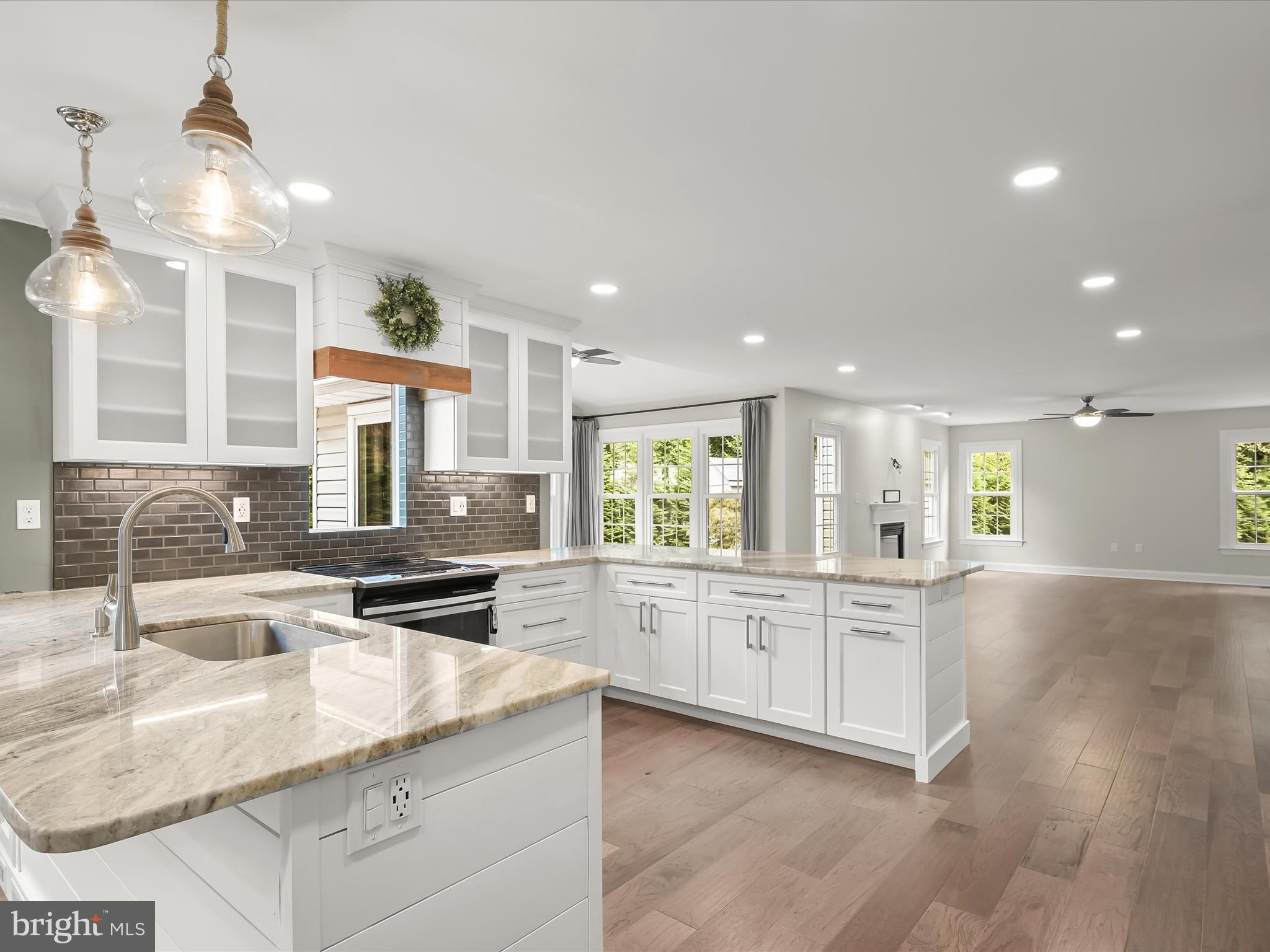 3720 Buffalo Road New Windsor, MD 21776 - Photo 17 of 115 a kitchen with stainless steel appliances granite countertop a sink and cabinets with wooden floor