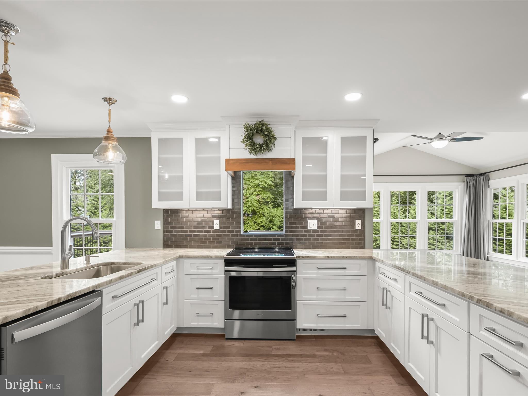 3720 Buffalo Road New Windsor, MD 21776 - Photo 3 of 115 a kitchen with stainless steel appliances granite countertop white cabinets and window