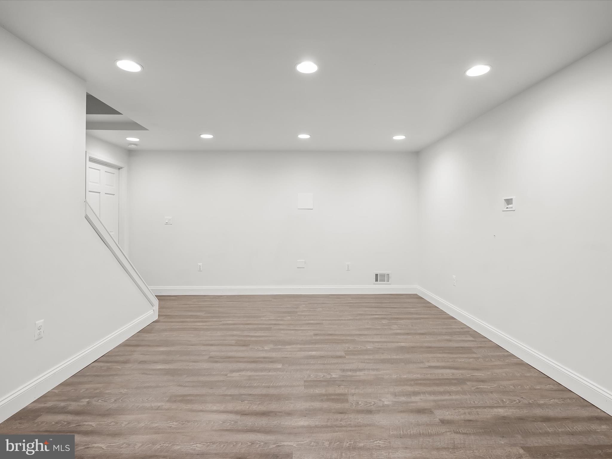 3720 Buffalo Road New Windsor, MD 21776 - Photo 53 of 115 an empty room with wooden floor and windows
