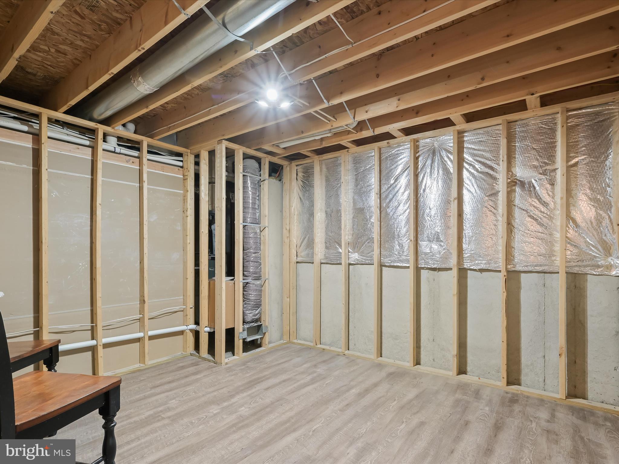 3720 Buffalo Road New Windsor, MD 21776 - Photo 61 of 115 a view of an empty room with wooden floor and a window