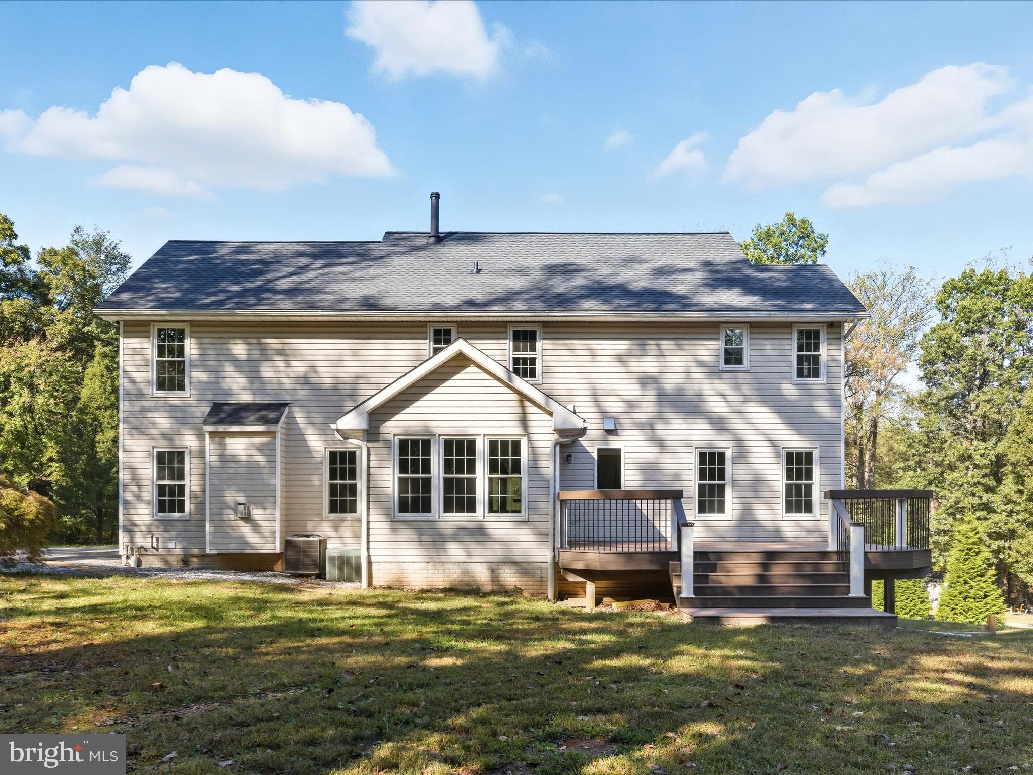 3720 Buffalo Road New Windsor, MD 21776 - Photo 73 of 115 a front view of a house with a garden and trees