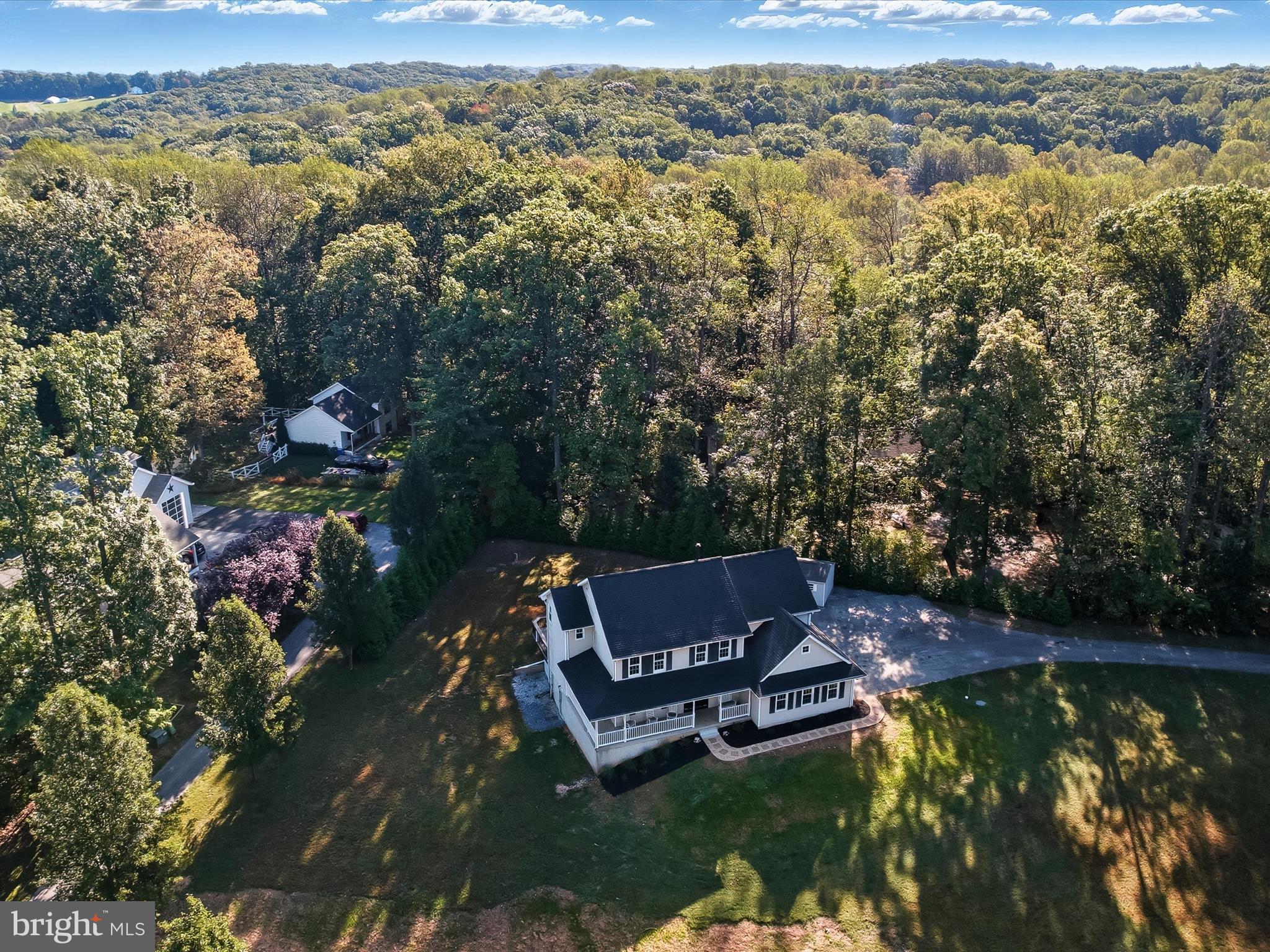 3720 Buffalo Road New Windsor, MD 21776 - Photo 86 of 115 an aerial view of a house with a garden and lake view