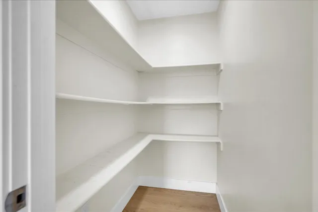a view of an empty walk in closet