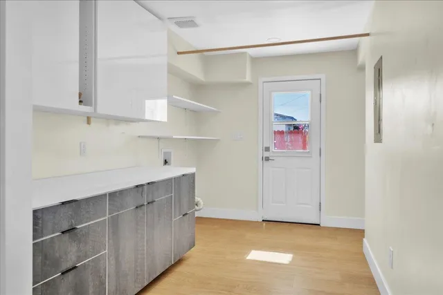 a view of cabinets and window