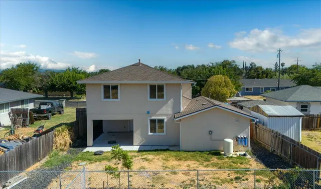 a house with trees in the background