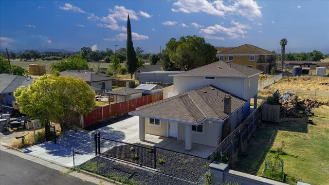 a terrace of a house with outdoor seating