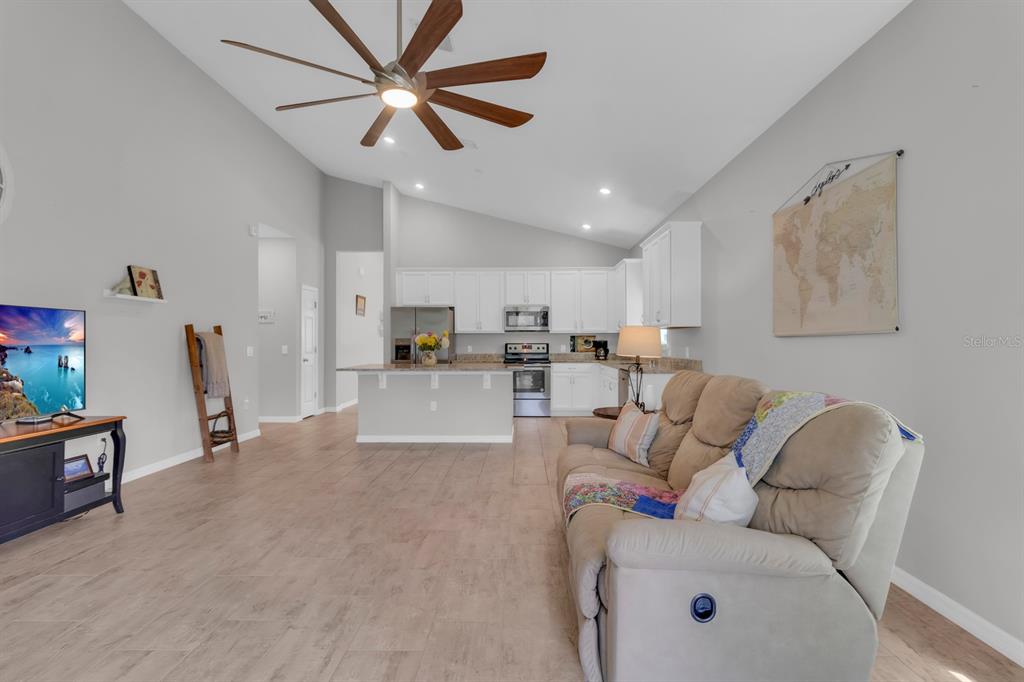 3468 Middlebrook Place St. Cloud, FL 34773 - Photo 11 of 32 a living room with furniture and kitchen view