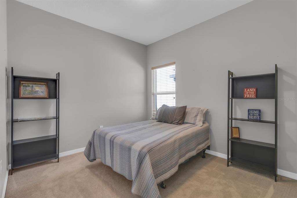 3468 Middlebrook Place St. Cloud, FL 34773 - Photo 15 of 32 a bedroom with a bed and a window