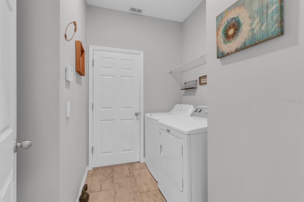 3468 Middlebrook Place St. Cloud, FL 34773 - Photo 19 of 32 a bathroom with a sink and mirror