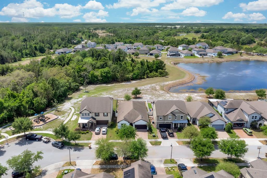 3468 Middlebrook Place St. Cloud, FL 34773 - Photo 2 of 32 an aerial view of a house with a lake view