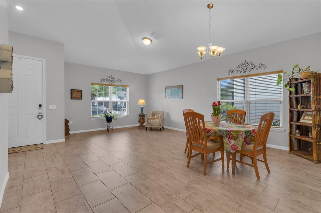 3468 Middlebrook Place St. Cloud, FL 34773 - Photo 4 of 32 a view of a dining room with furniture and chandelier