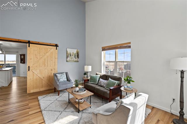 8205 Fort Smith Road Peyton, CO 80831 - Photo 2 of 49 Light and bright sitting area greets you as you walk in