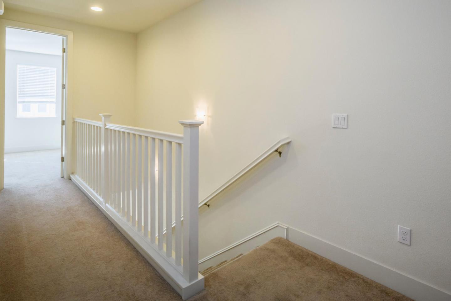 2912 Shoemaker Dr. San Mateo, CA 94403 - Photo 12 of 27 a view of a hallway with staircase