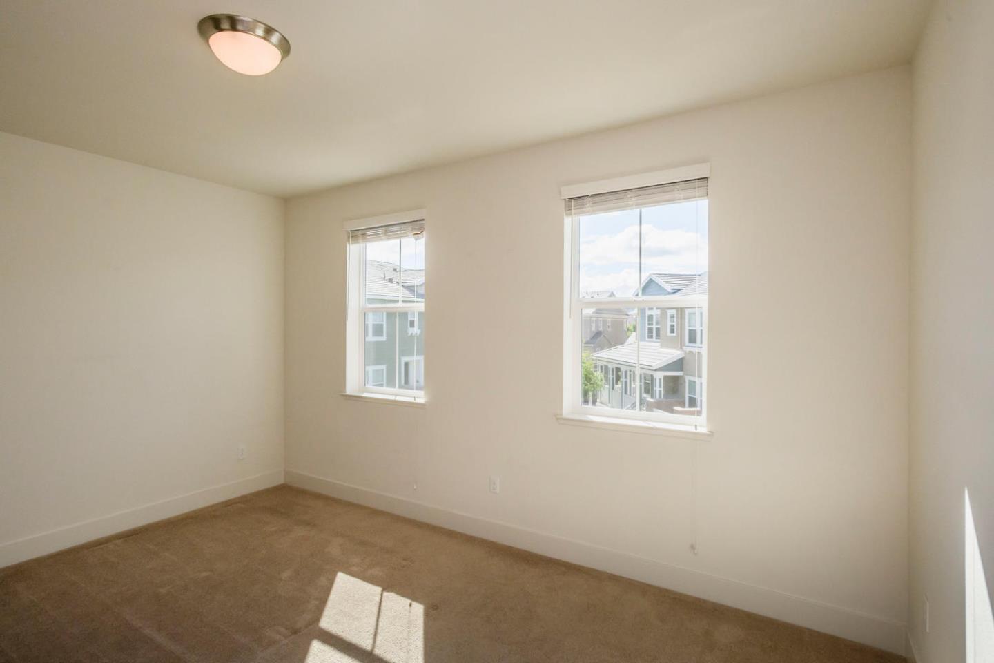 2912 Shoemaker Dr. San Mateo, CA 94403 - Photo 13 of 27 an empty room with windows