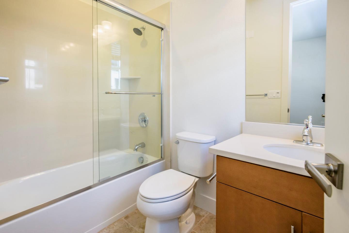 2912 Shoemaker Dr. San Mateo, CA 94403 - Photo 17 of 27 a bathroom with a sink toilet and shower