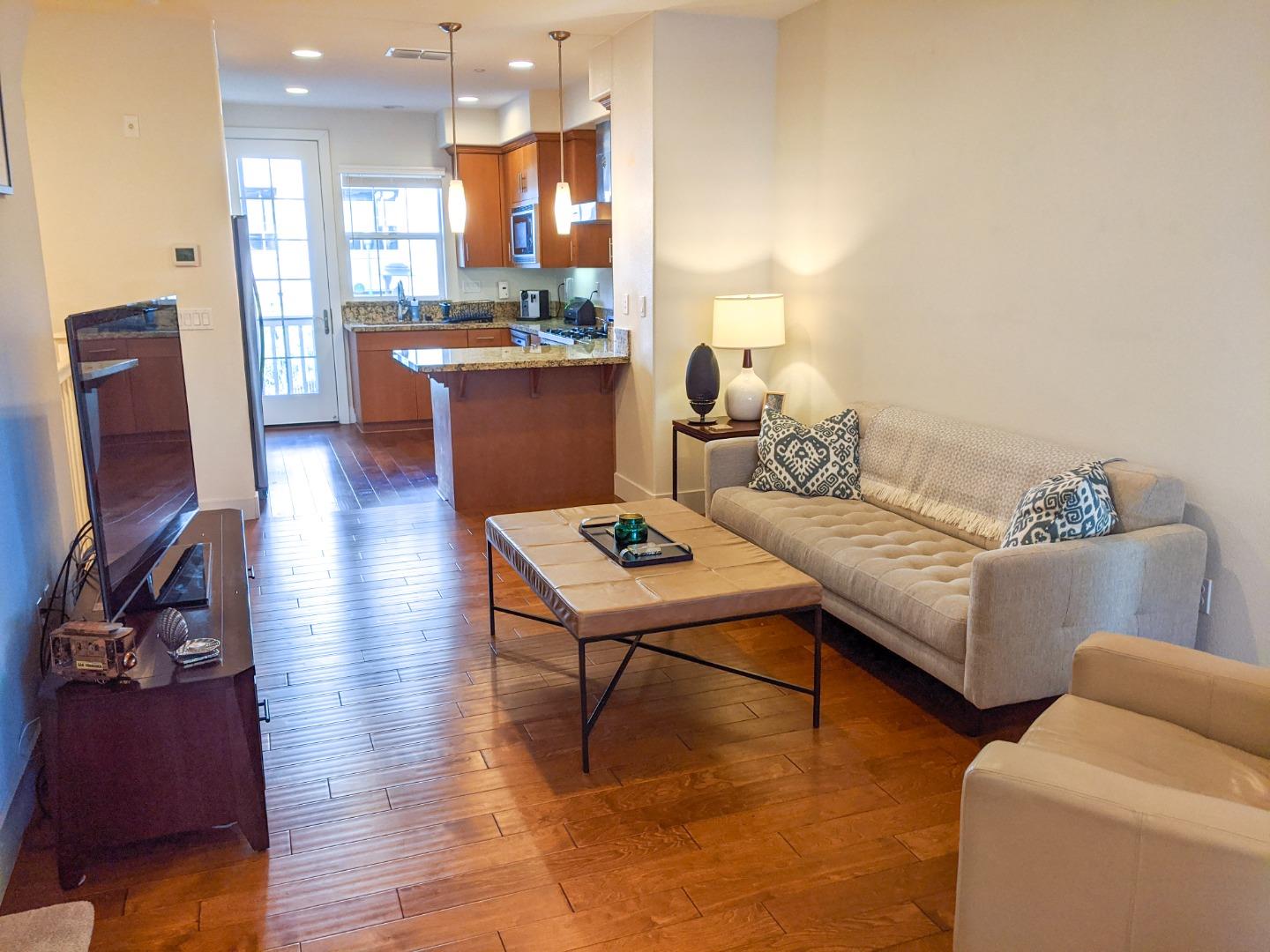2912 Shoemaker Dr. San Mateo, CA 94403 - Photo 4 of 27 a living room with furniture and a flat screen tv