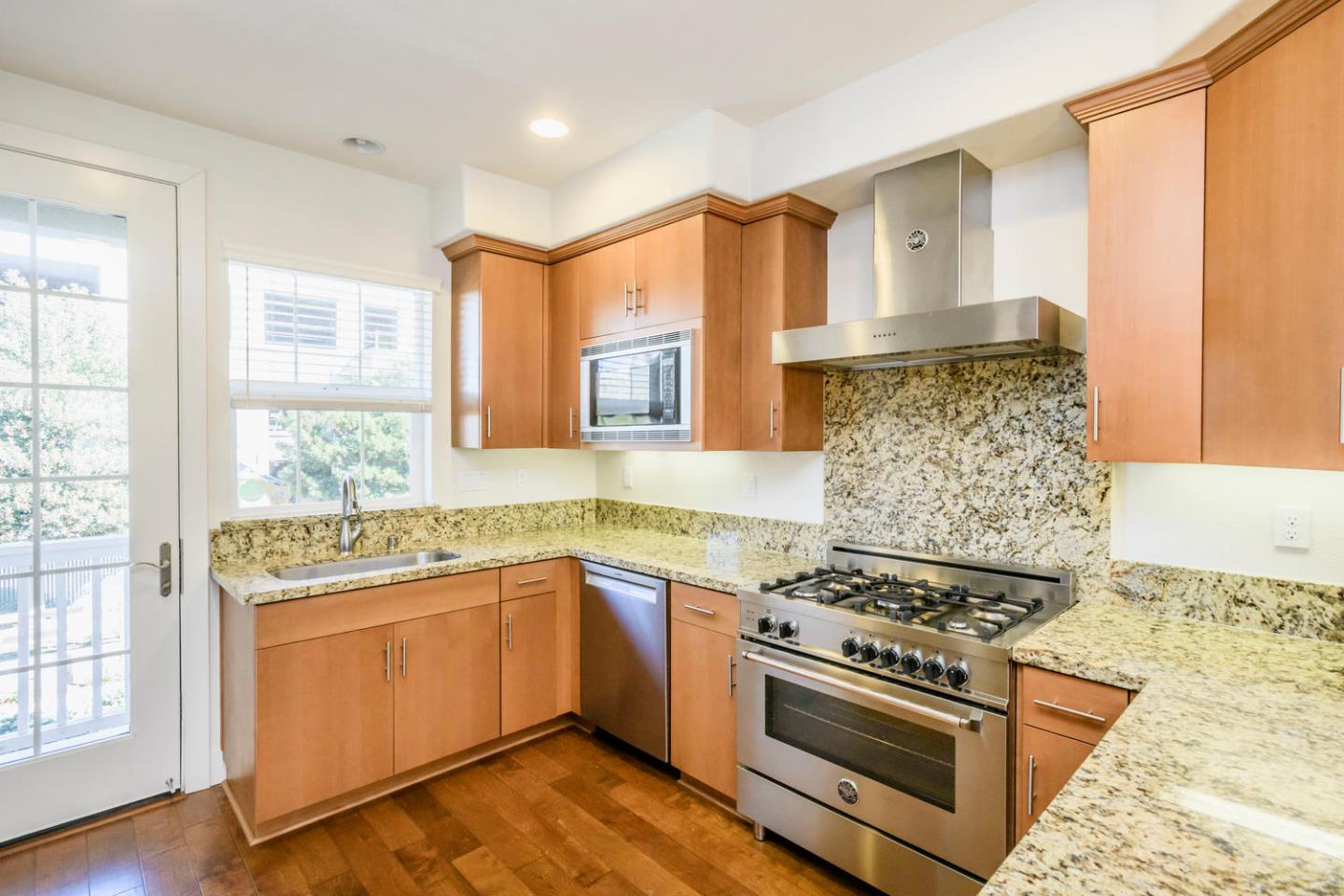 2912 Shoemaker Dr. San Mateo, CA 94403 - Photo 6 of 27 a kitchen with a stove and a sink