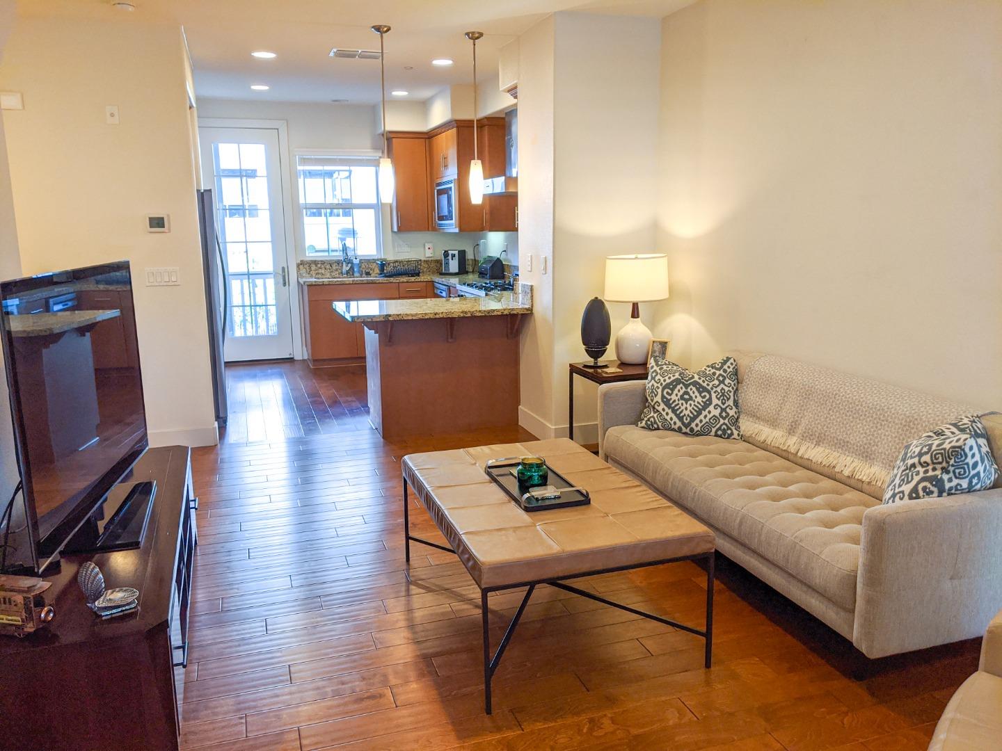 2912 Shoemaker Dr. San Mateo, CA 94403 - Photo 10 of 27 a living room with furniture and a flat screen tv