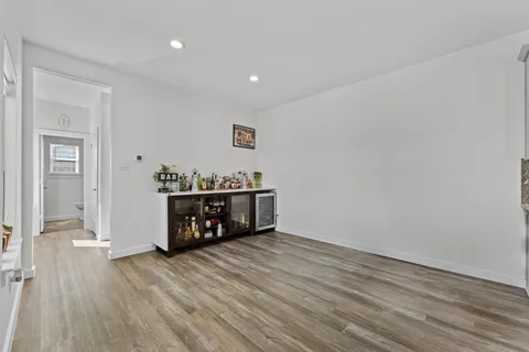 a room with wooden floor and furniture
