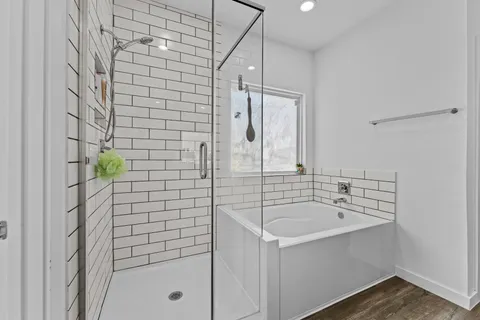 a bathroom with a sink a mirror and shower