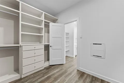 an empty room with a empty space and a ceiling fan