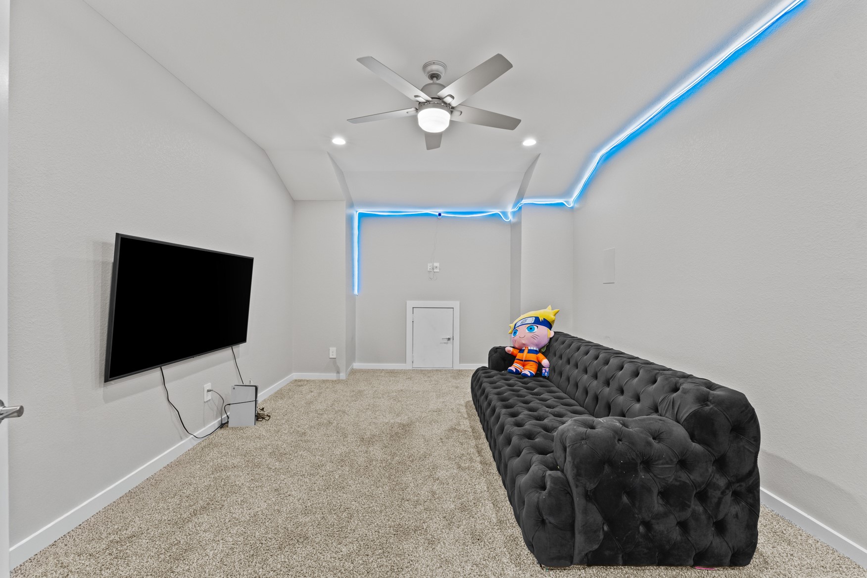 22503 Modica Rift Lane Katy, TX 77449 - Photo 26 of 42 a living room with furniture and a flat screen tv