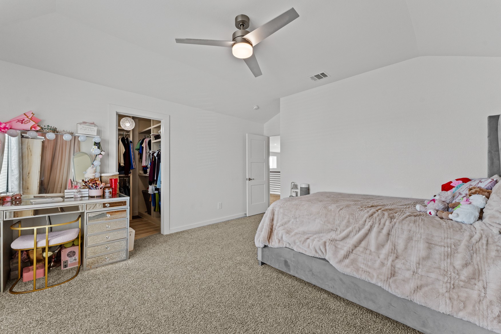 22503 Modica Rift Lane Katy, TX 77449 - Photo 29 of 42 a bedroom with bed and a chandelier