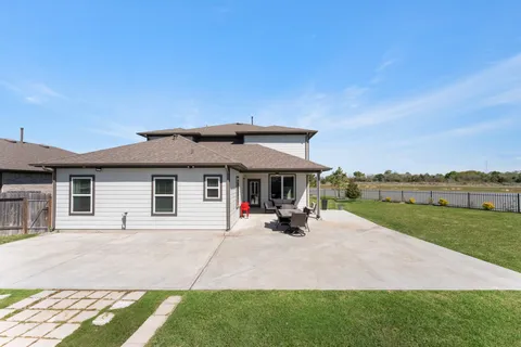 a view of a house with sitting area and garden