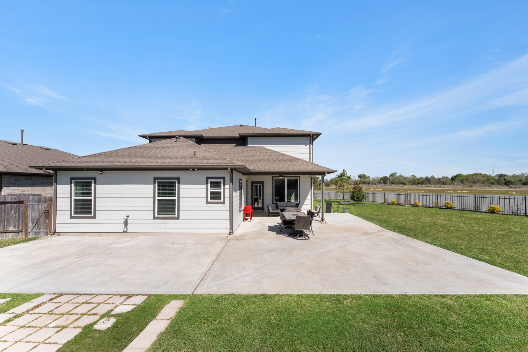 22503 Modica Rift Lane Katy, TX 77449 - Photo 39 of 42 a view of a house with sitting area and garden