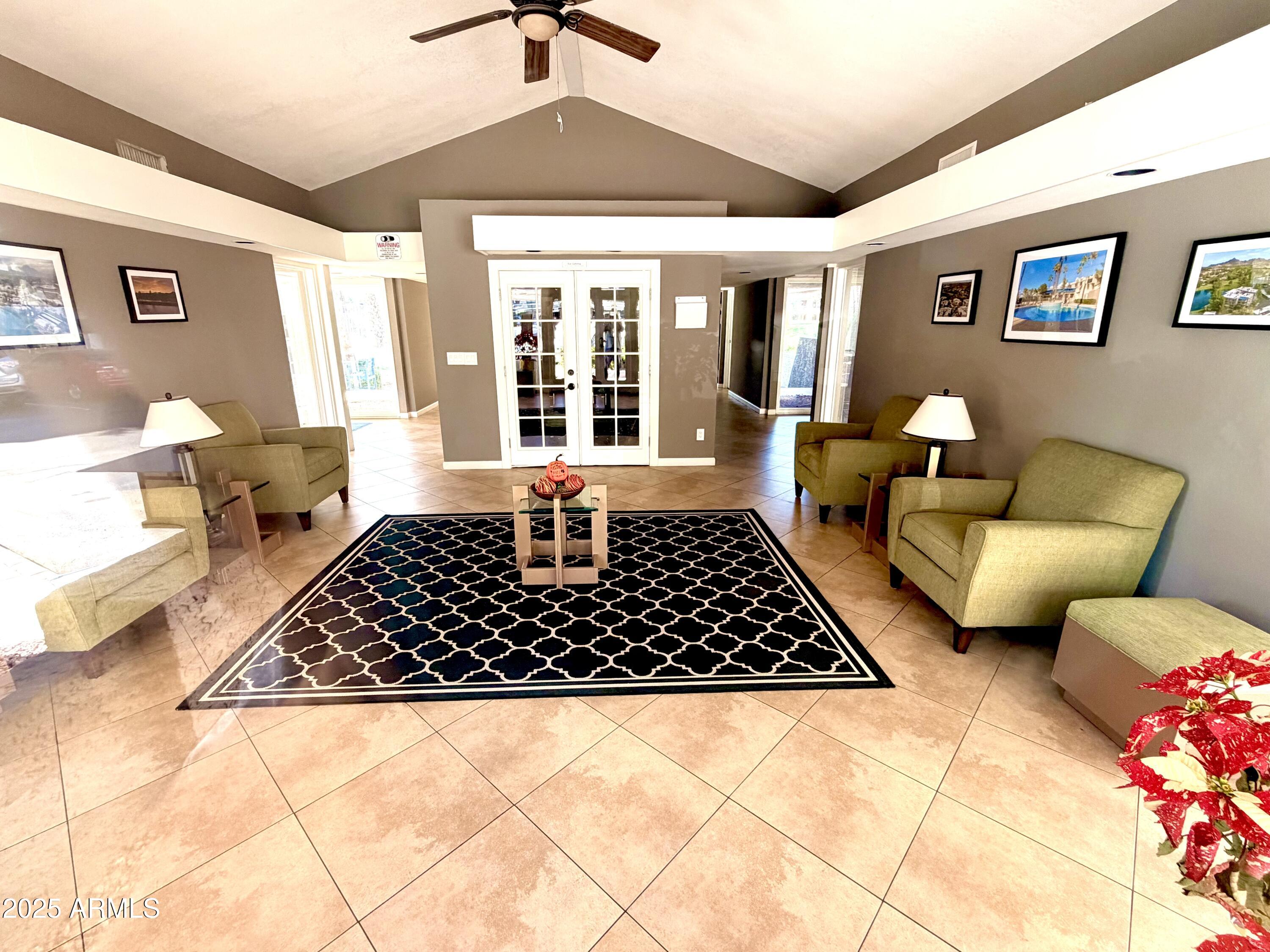5136 North 31st Place, Unit 634 Phoenix, AZ 85016 - Photo 41 of 45 a living room with a couch and a table