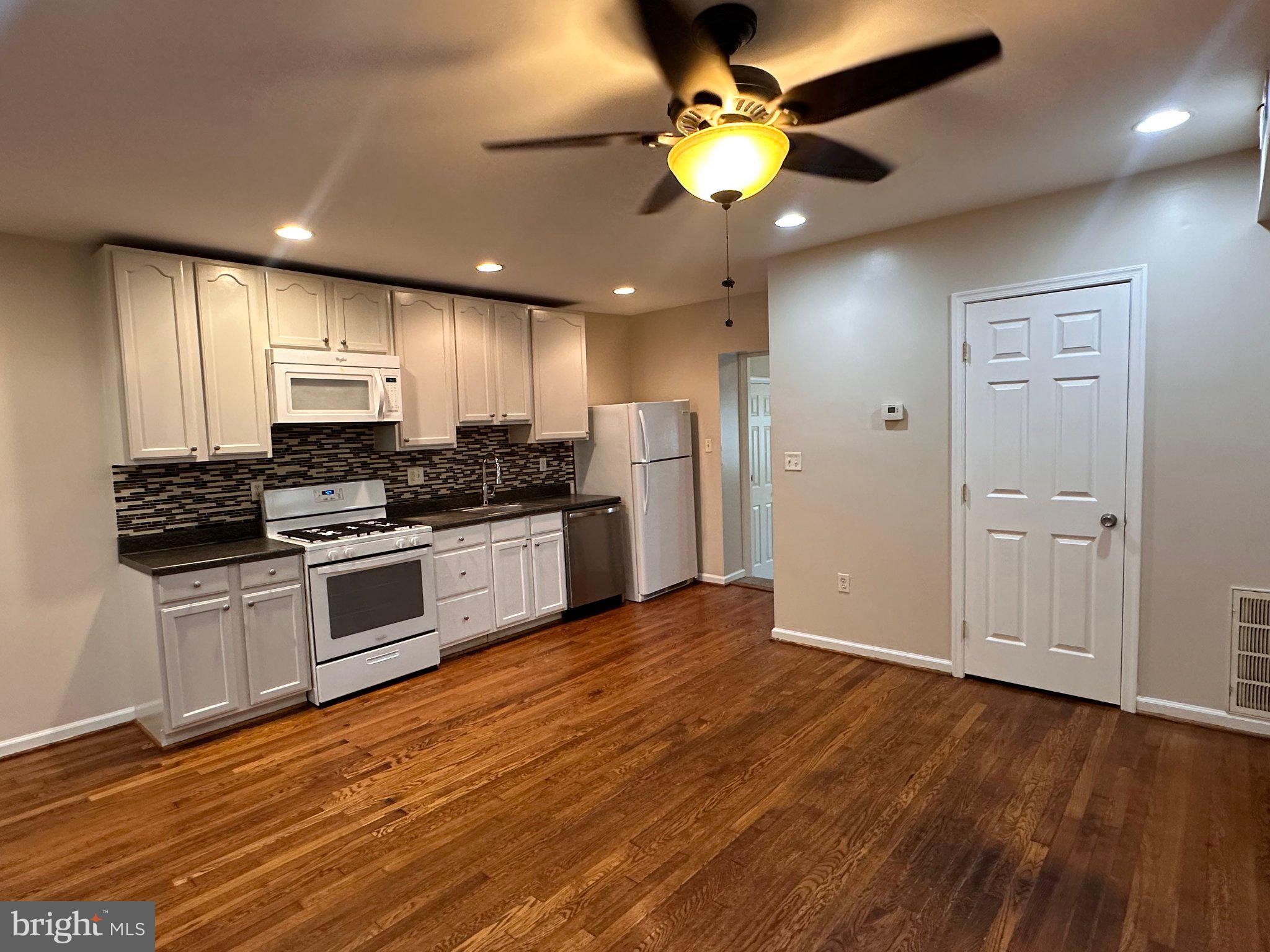 1913 Rosedale Street Northeast, Unit 1 Washington, DC 20002 - Photo 8 of 12 Modern kitchen with warm wood floors.